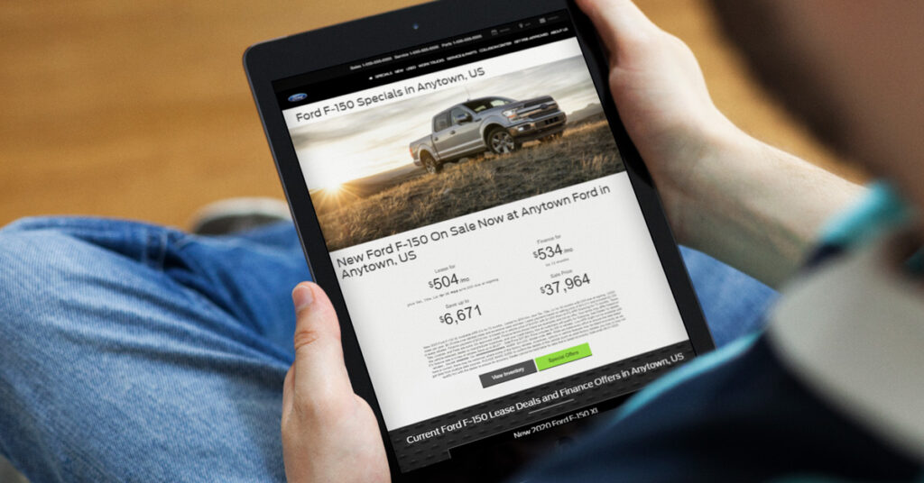 person looking at a ford landing page on a tablet
