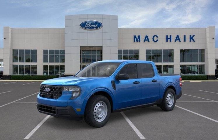 Mac Haik Ford with a blue truck